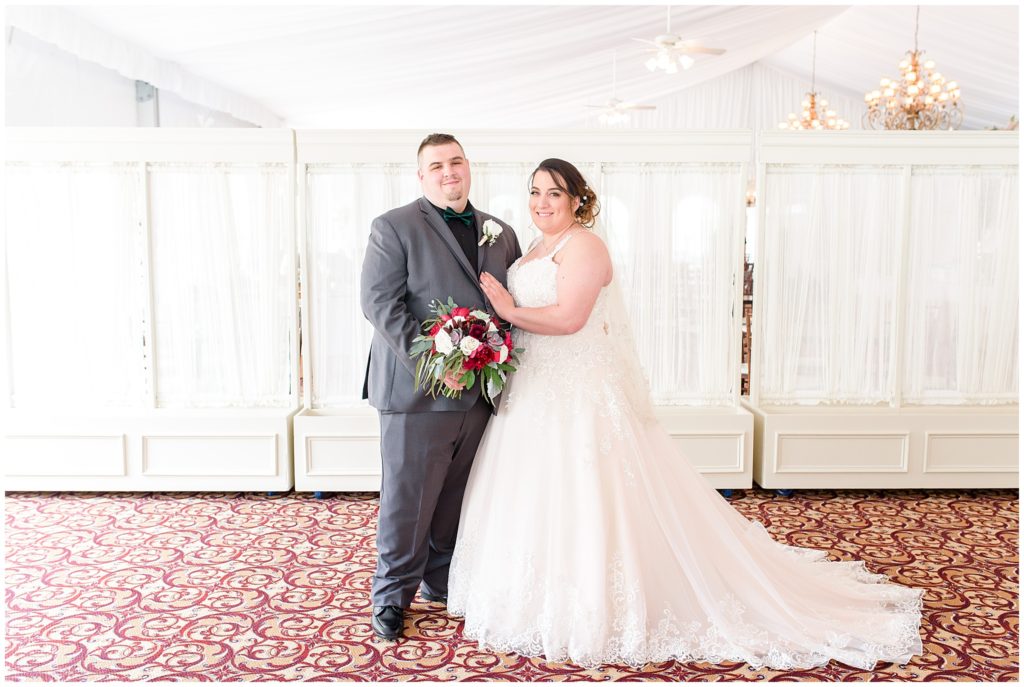 bride and groom portraits in white tent
