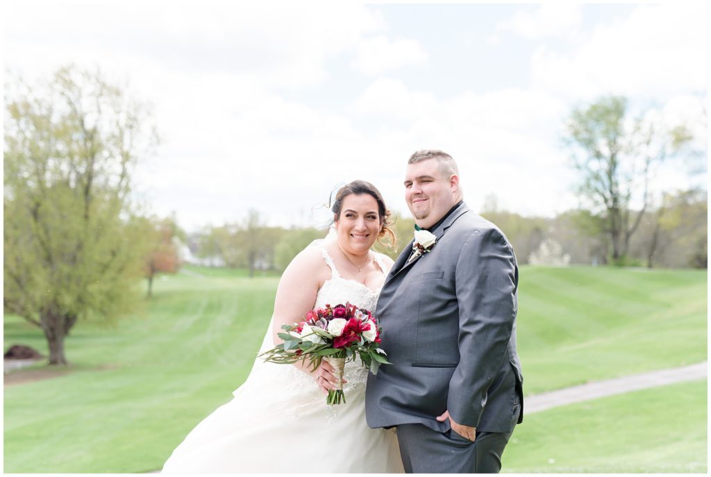 bride and groom portraits on golf course