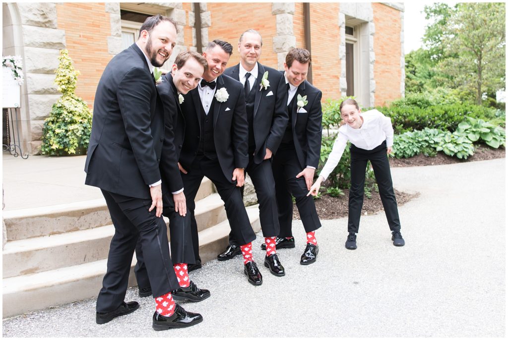 groomsmen in front of estate fun socks