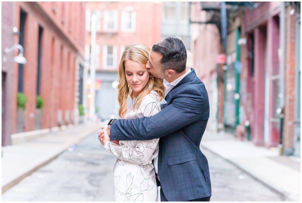 couple lovingly posing in nyc alley