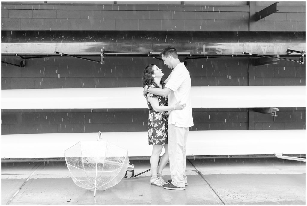 couple embracing each other in rain 
