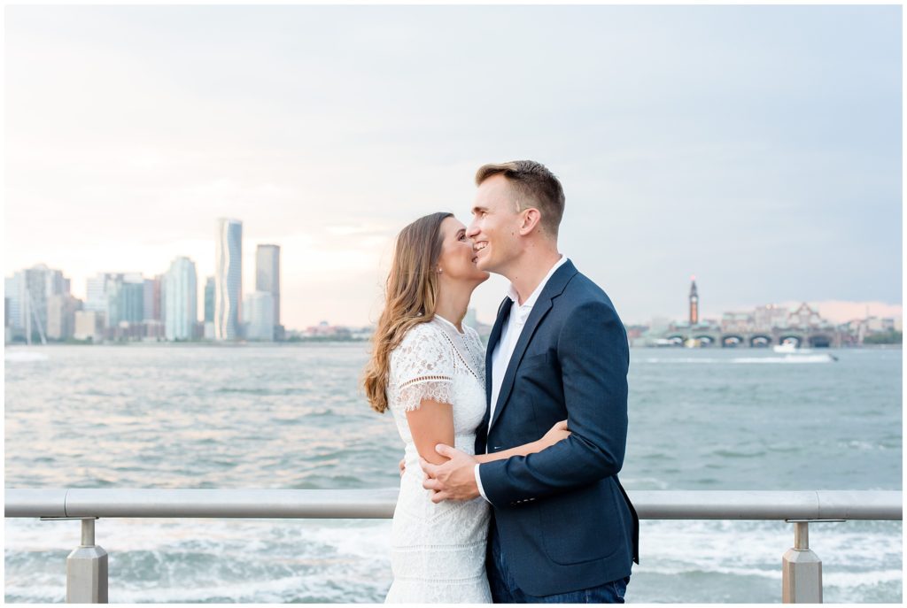 couple embracing with city skyline