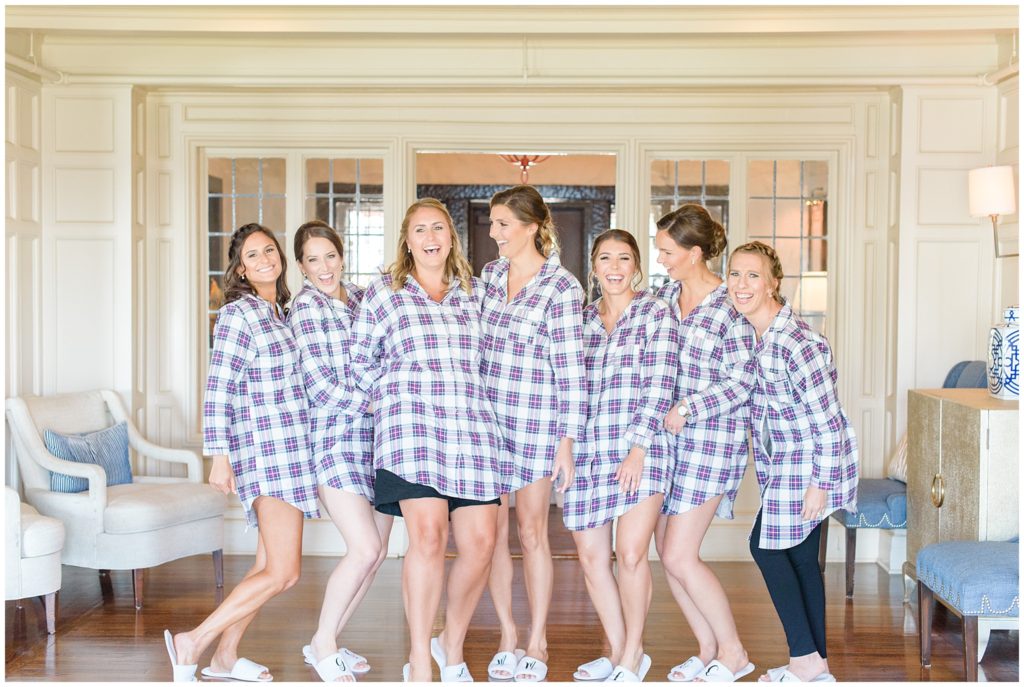 bridesmaids laughing in matching flannel pjs